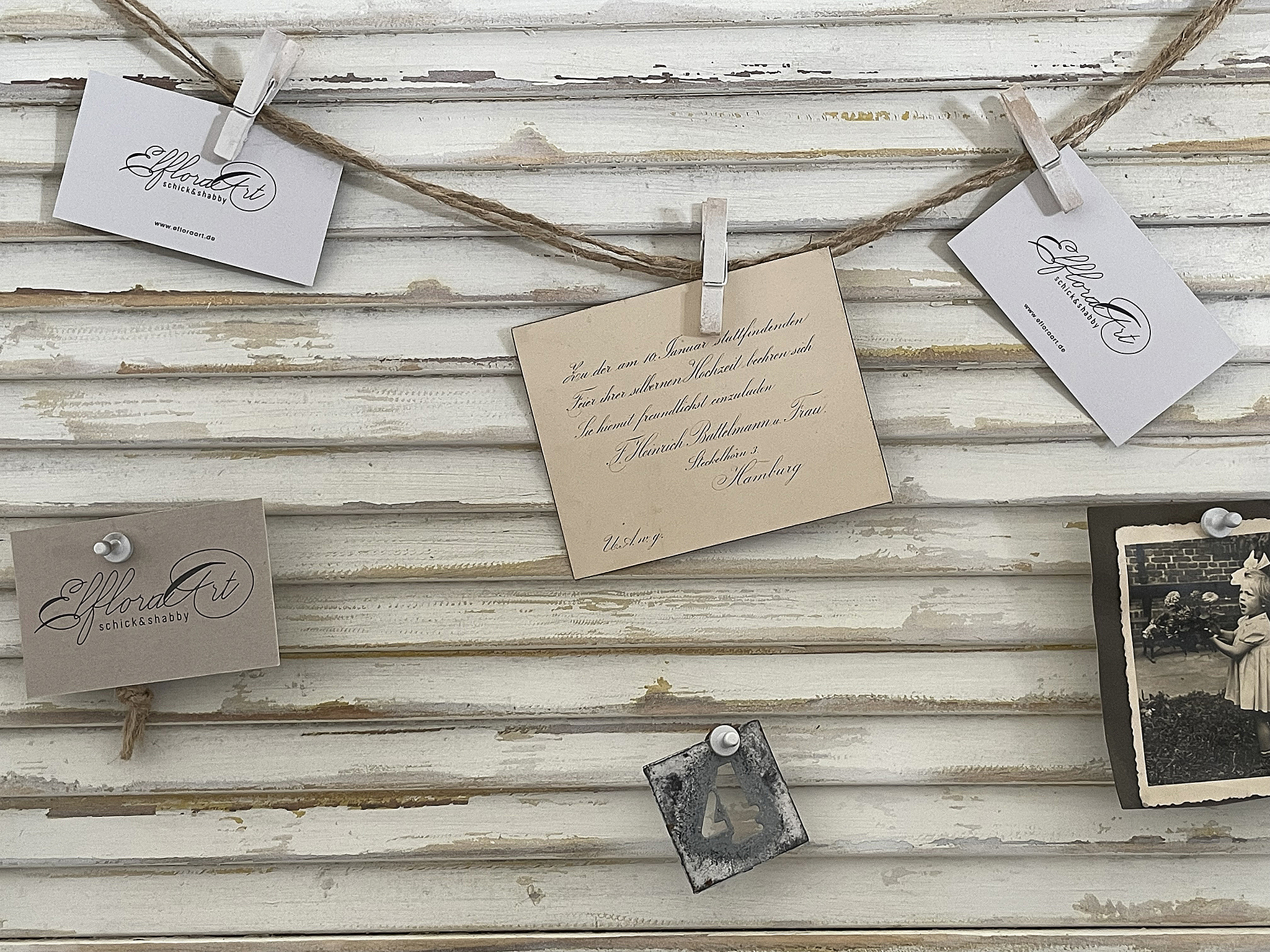 Decorative cards and photos hanging on a string